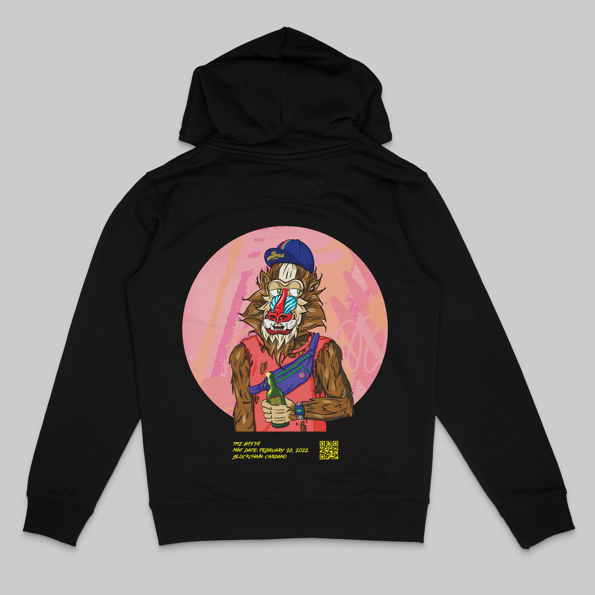 the back side of a black colored hoodie from the brand Stanley Stella with a colorful mandrill print in comic style. Blockchain information under print in yellow letters and QR code